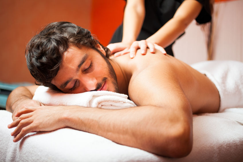 41808456 - man having a massage in a wellness center